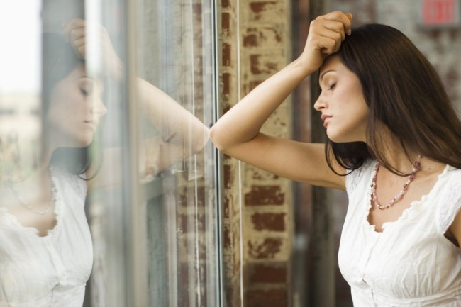 Woman Staring Out Window