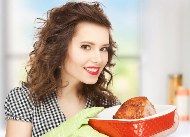picture of perfect housewife serving dish with meat