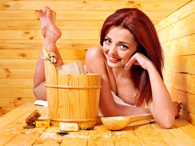 Young woman in sauna. Healthy lifestyle.