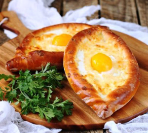 Recipe for a real khachapuri on Ajarsky step by step with a photo. How to prepare an Ajars Khachapuri in Georgian. How to eat Khachapuri on Ajars